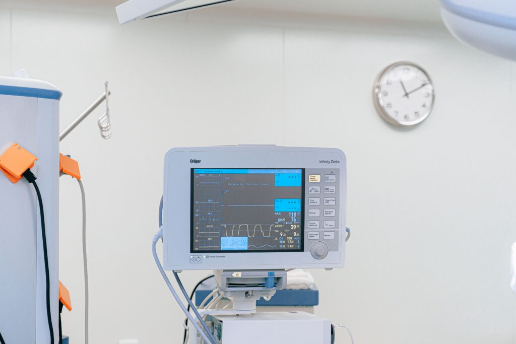 A modern heart rate monitor in a sterile hospital setting, showcasing medical technology.